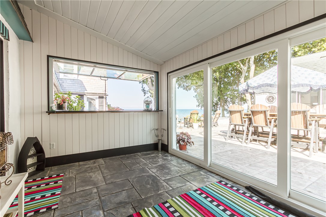 3079 Lake Road Williamson, NY 14589 - Photo 35 of 50 GARDEN ROOM OFF KITCHEN WITH COUNTER AREA WITH WIN
