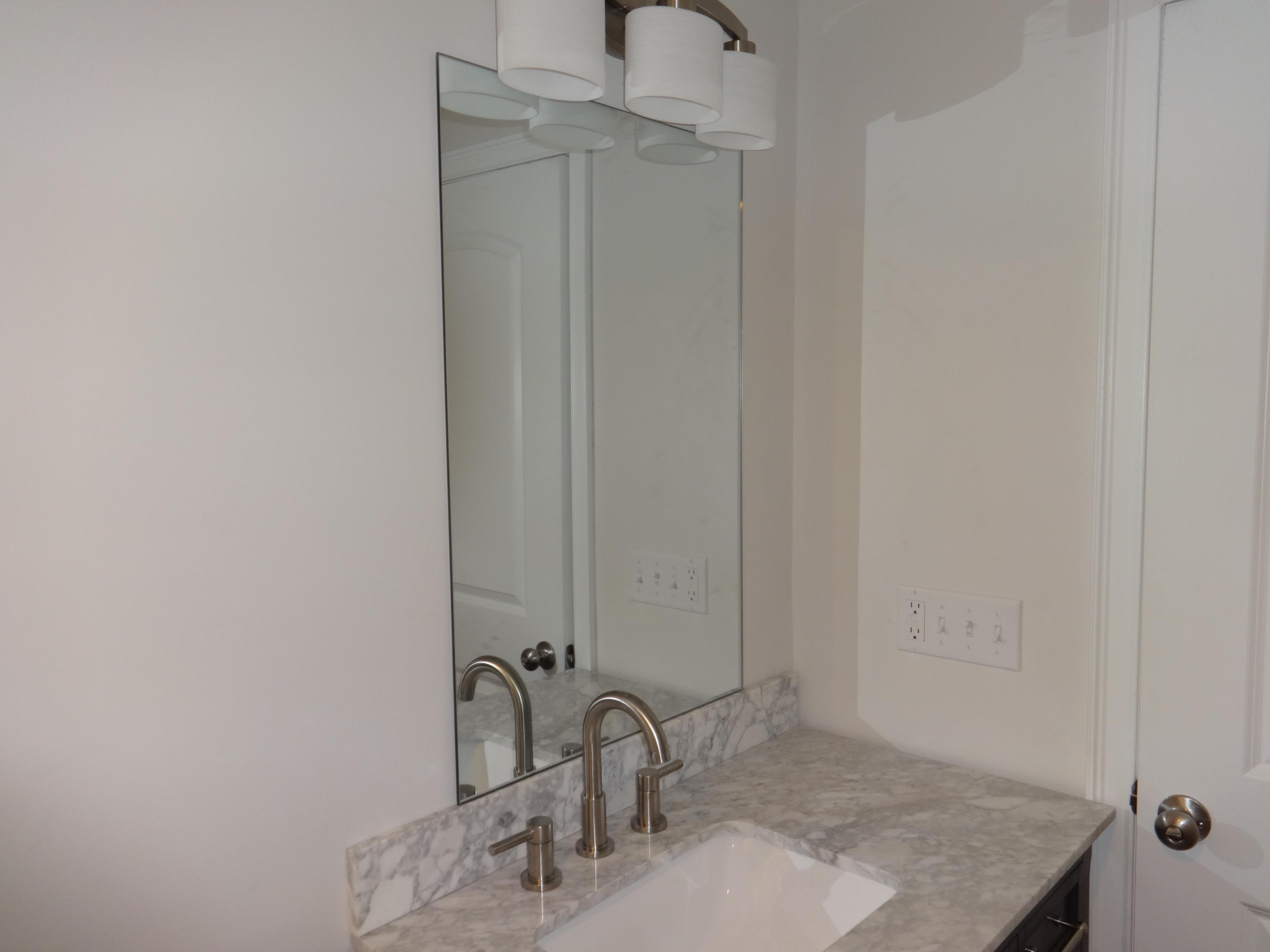15 Cliff Road Monument Beach, MA 02532 - Photo 12 of 28 a bathroom with a sink and vanity