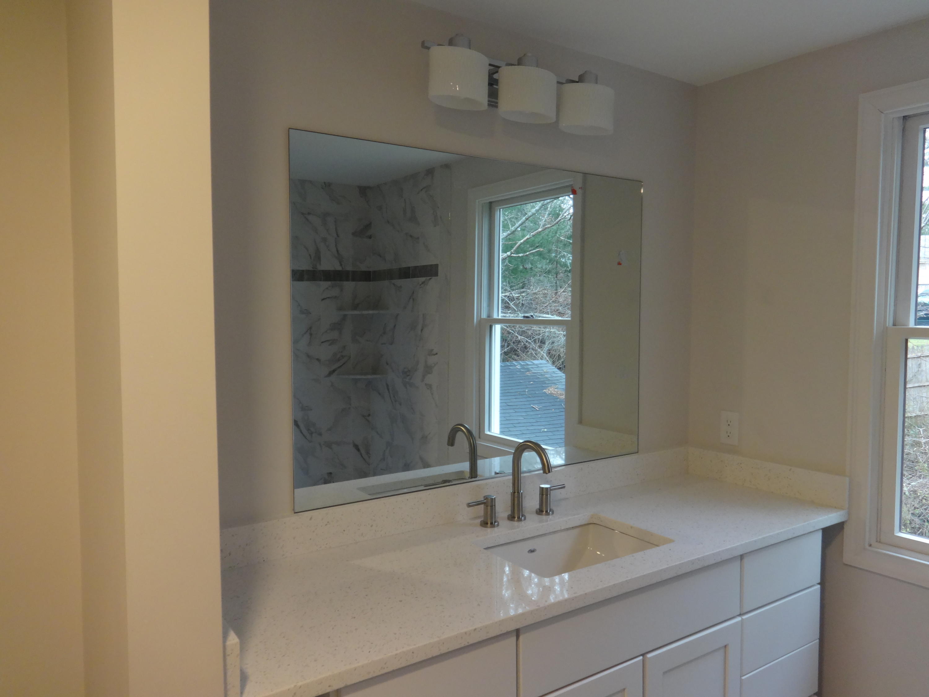 15 Cliff Road Monument Beach, MA 02532 - Photo 19 of 28 a bathroom with a sink and a mirror