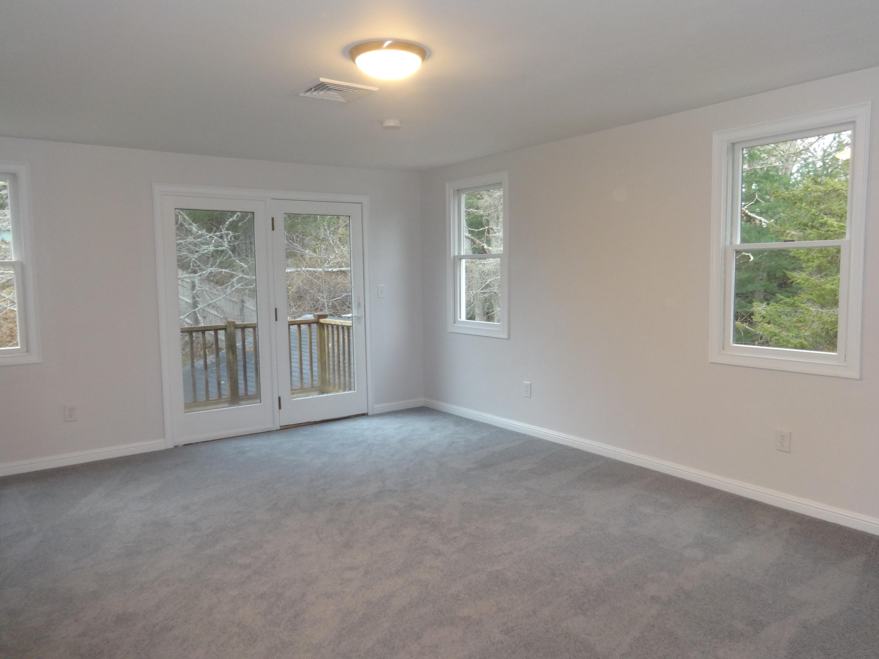 15 Cliff Road Monument Beach, MA 02532 - Photo 21 of 28 an empty room with windows