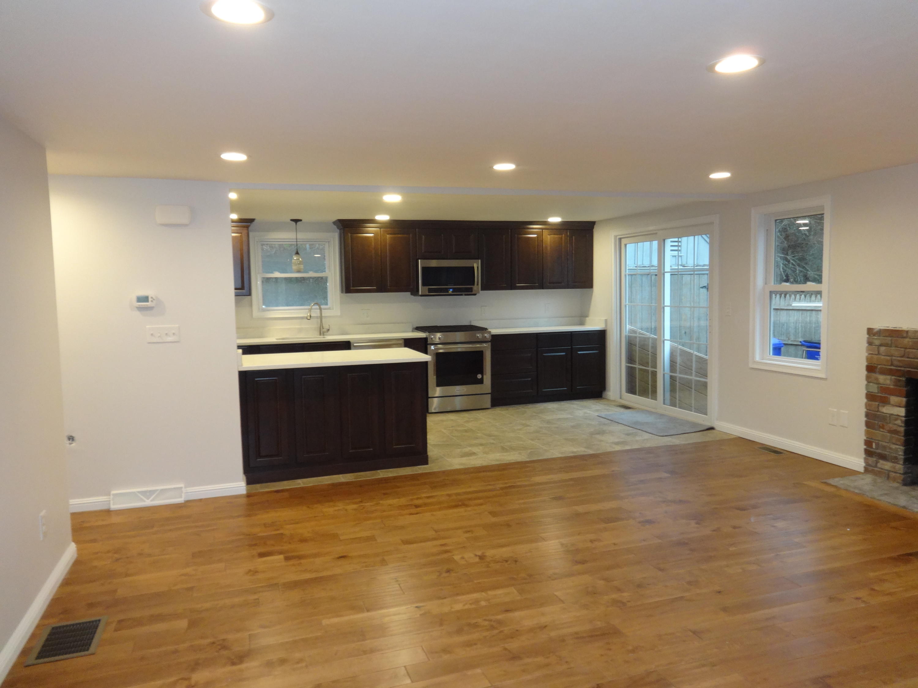15 Cliff Road Monument Beach, MA 02532 - Photo 3 of 28 a large kitchen with stainless steel appliances granite countertop a sink and cabinets
