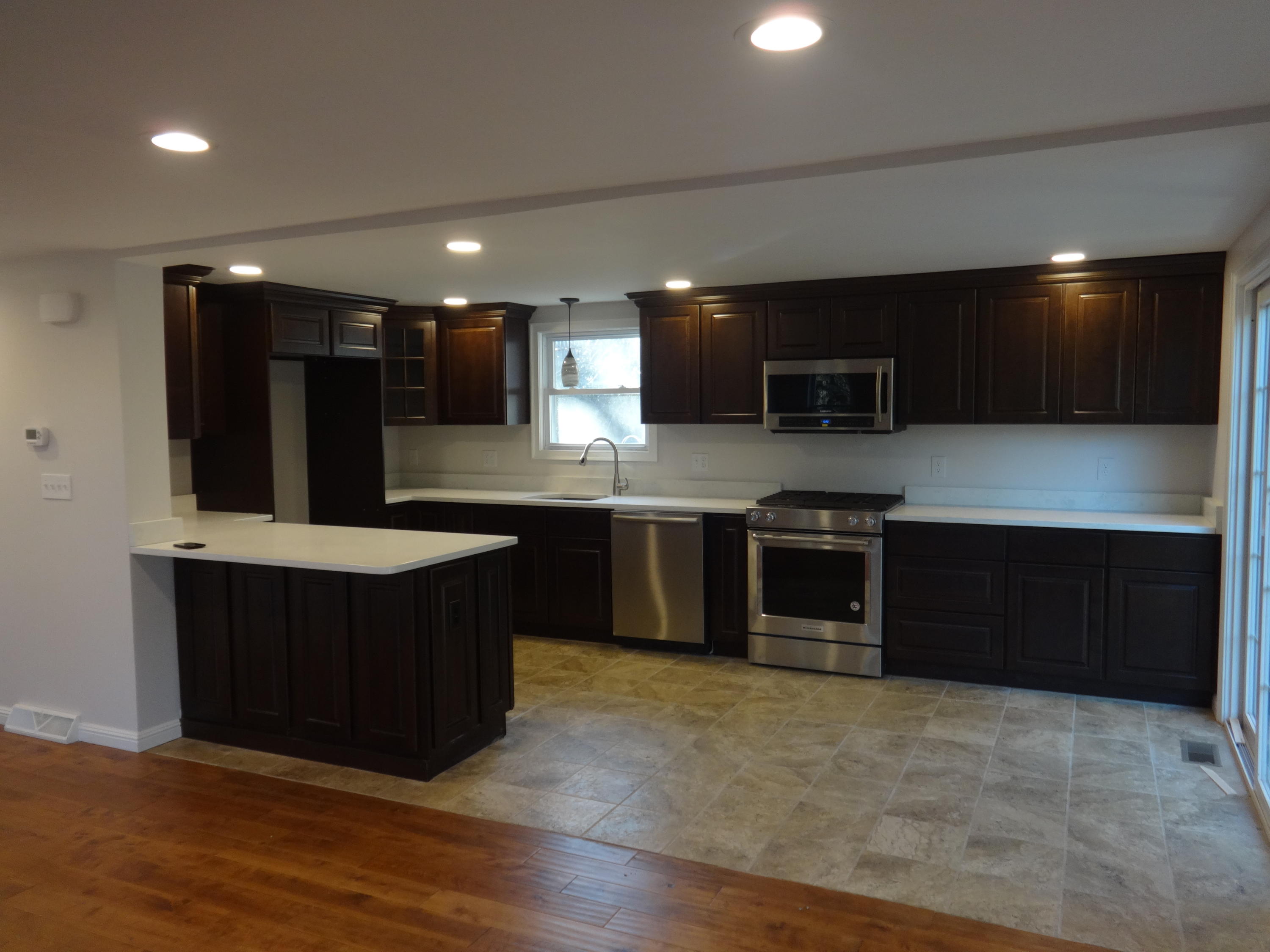 15 Cliff Road Monument Beach, MA 02532 - Photo 4 of 28 a kitchen with kitchen island stainless steel appliances a sink stove and refrigerator