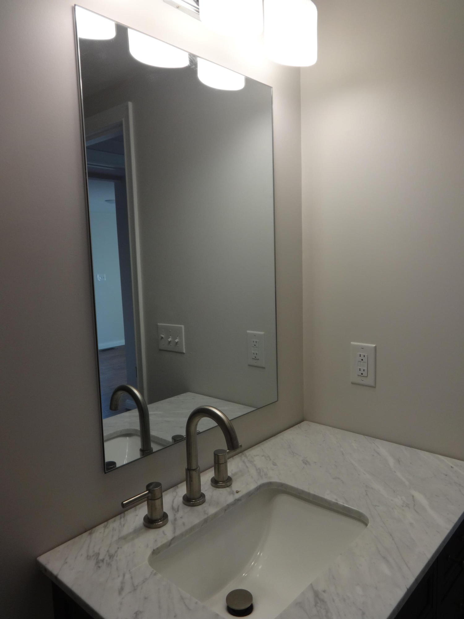 15 Cliff Road Monument Beach, MA 02532 - Photo 8 of 28 a bathroom with a sink and mirror