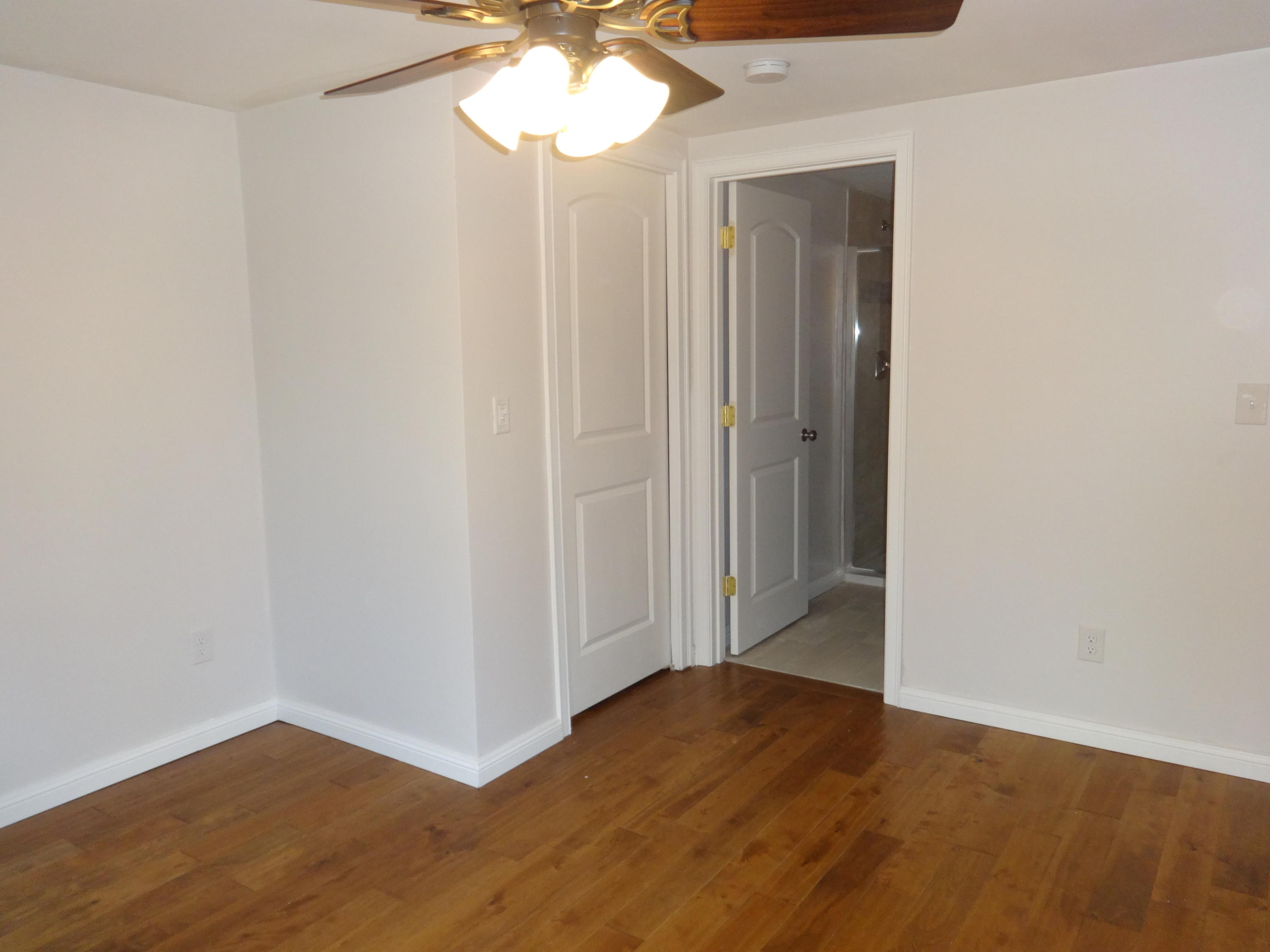 15 Cliff Road Monument Beach, MA 02532 - Photo 10 of 28 a view of an empty room with wooden floor