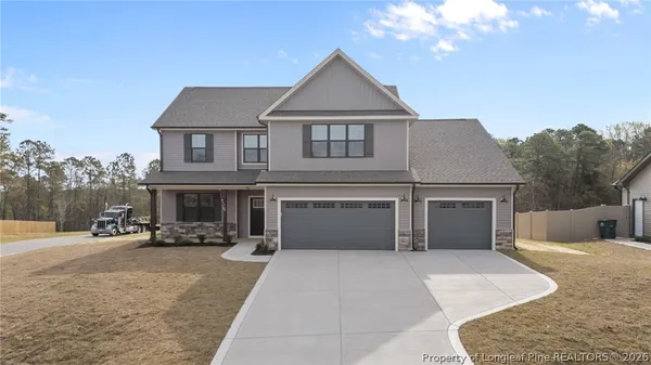 a view of house with yard and entertaining space