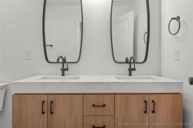 a bathroom with a sink and mirror