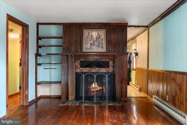 a spacious bedroom with a bed and a large window