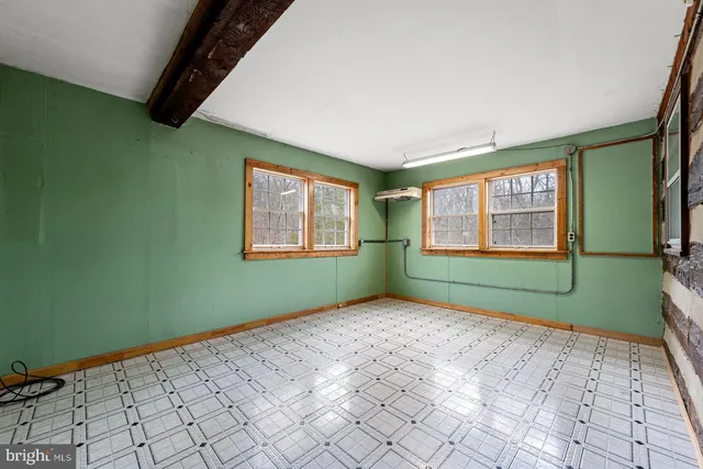 a view of balcony with wooden floor and fence