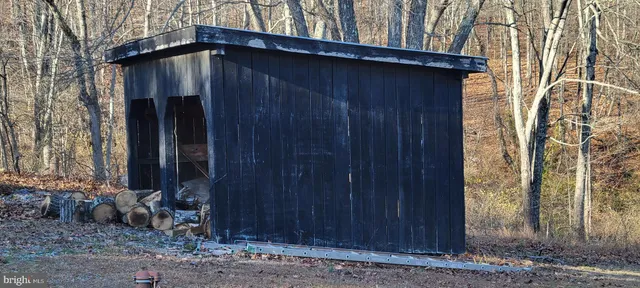 a view of a backyard with mountain view and sitting space