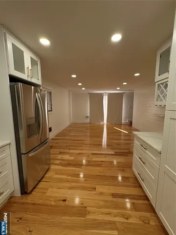 a bathroom with a toilet a sink and a mirror