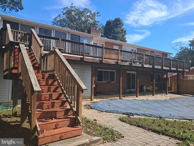 a view of a house with wooden deck