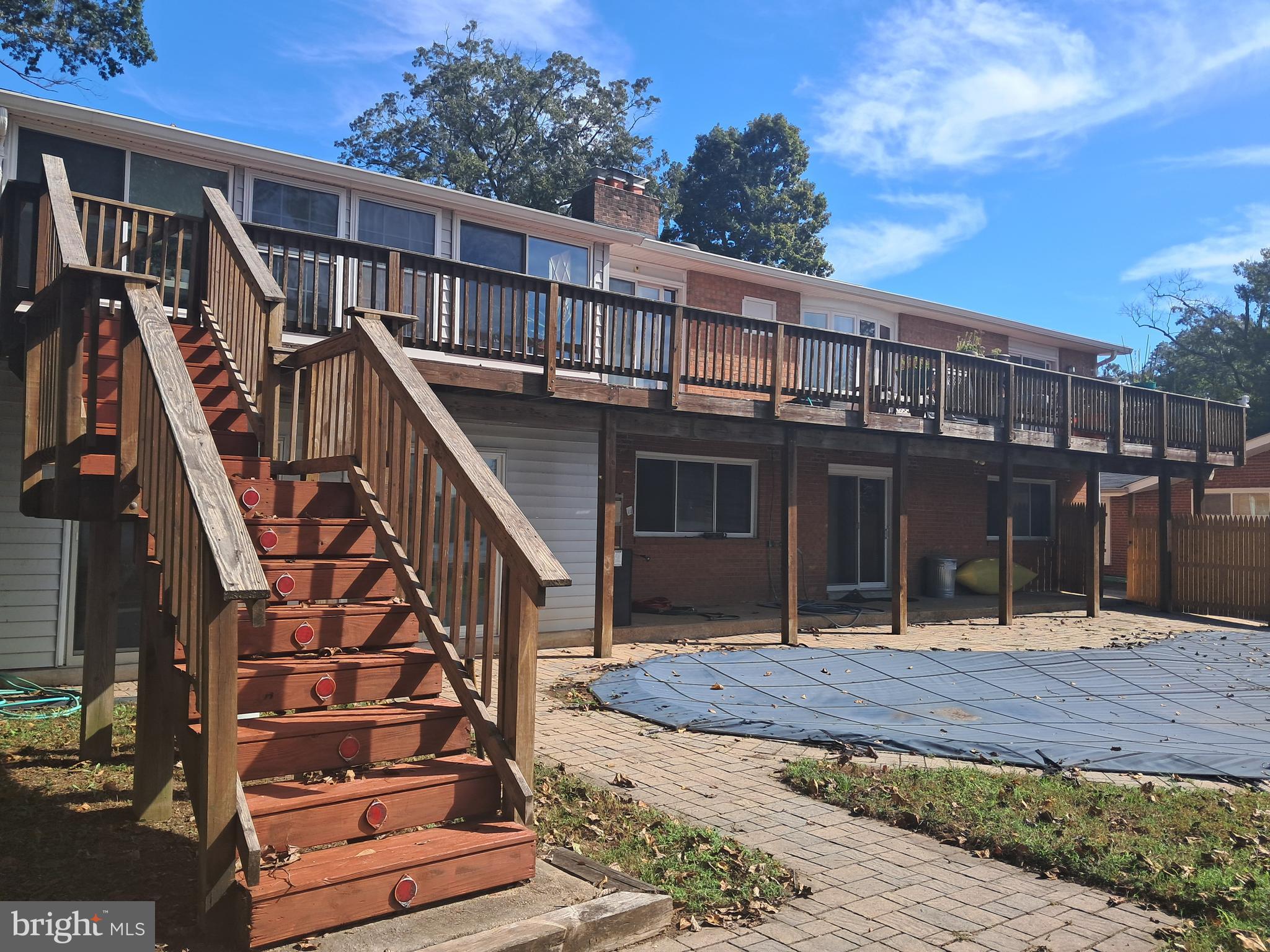 a view of a house with wooden deck