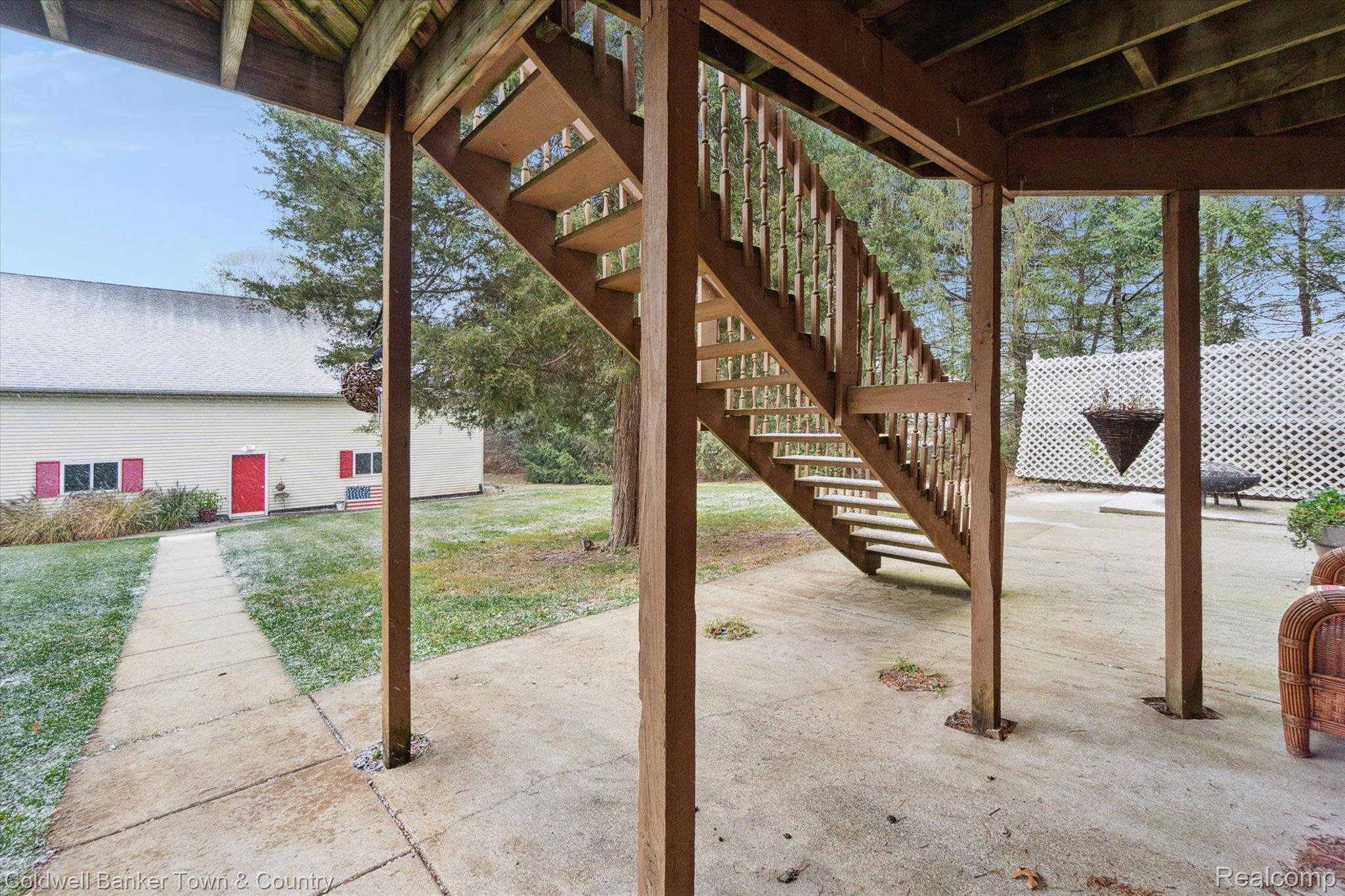 4928 Nature View Court Howell, MI 48843 - Photo 49 of 66 Patio View w/Sidewalk to Heated Pole Barn