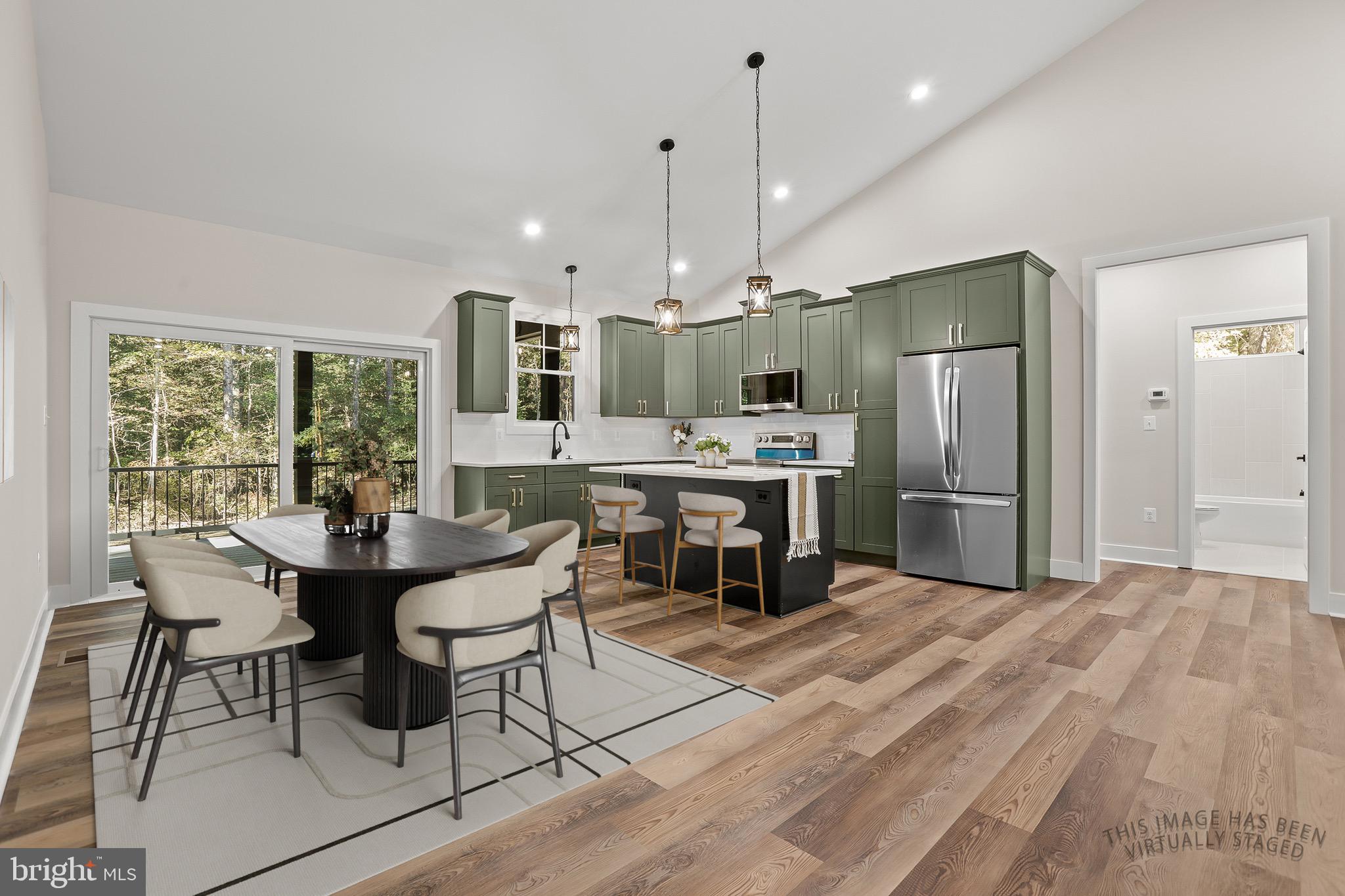195 North Glebe Road Montross, VA 22520 - Photo 11 of 53 a kitchen with stainless steel appliances kitchen island granite countertop a refrigerator and a stove top oven