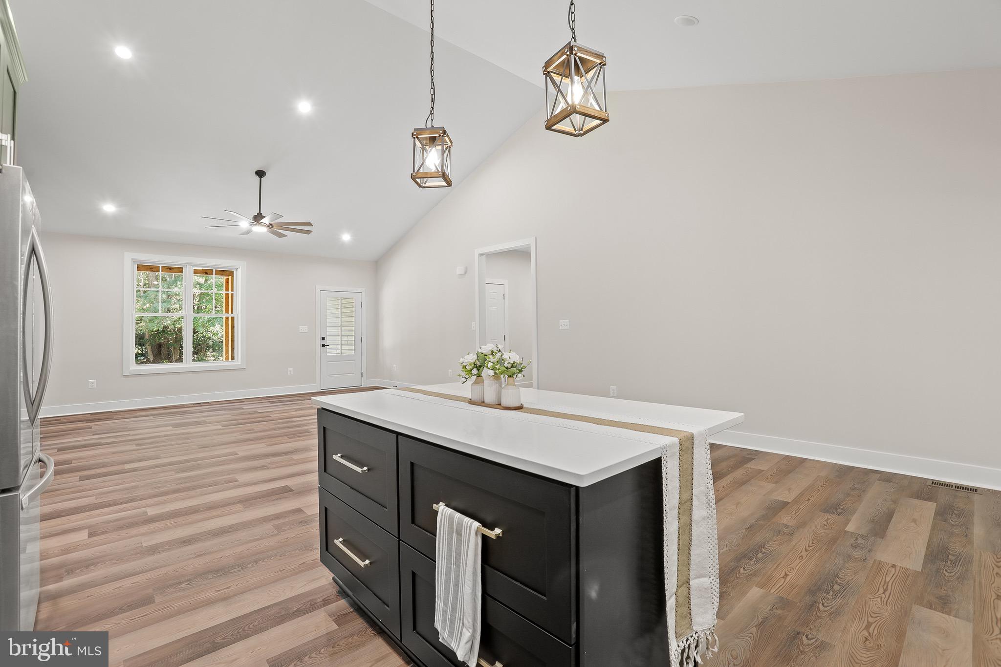 195 North Glebe Road Montross, VA 22520 - Photo 15 of 53 a kitchen with a sink cabinets and wooden floor