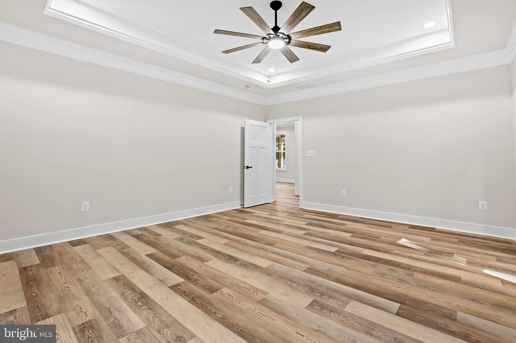 195 North Glebe Road Montross, VA 22520 - Photo 21 of 53 a view of a room with wooden floor and a ceiling fan