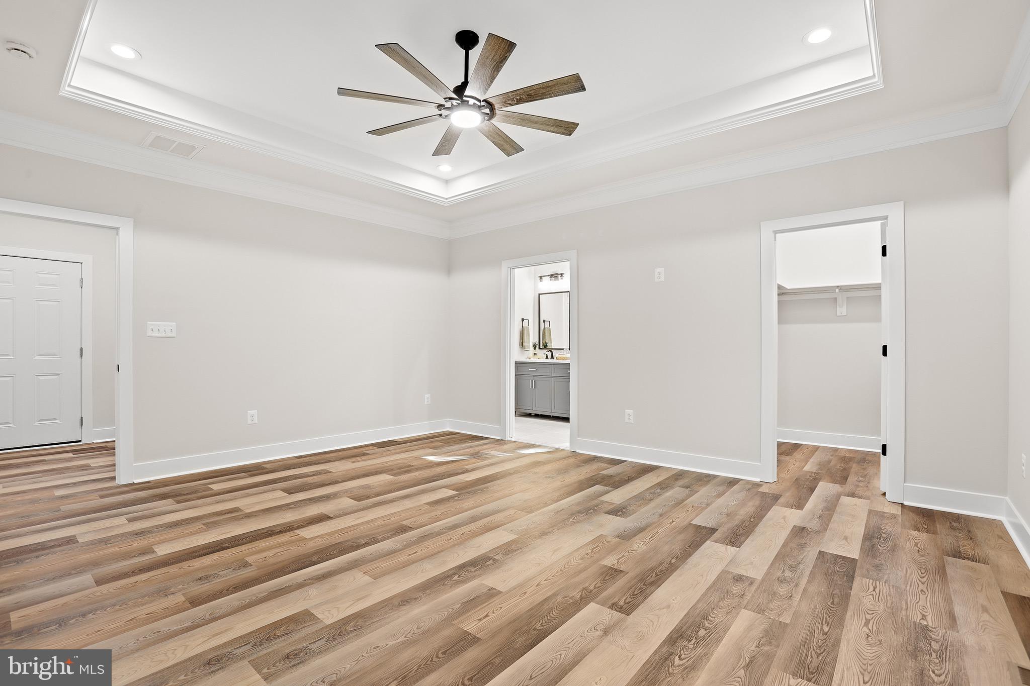 195 North Glebe Road Montross, VA 22520 - Photo 24 of 53 a view of an empty room with wooden floor and a ceiling fan