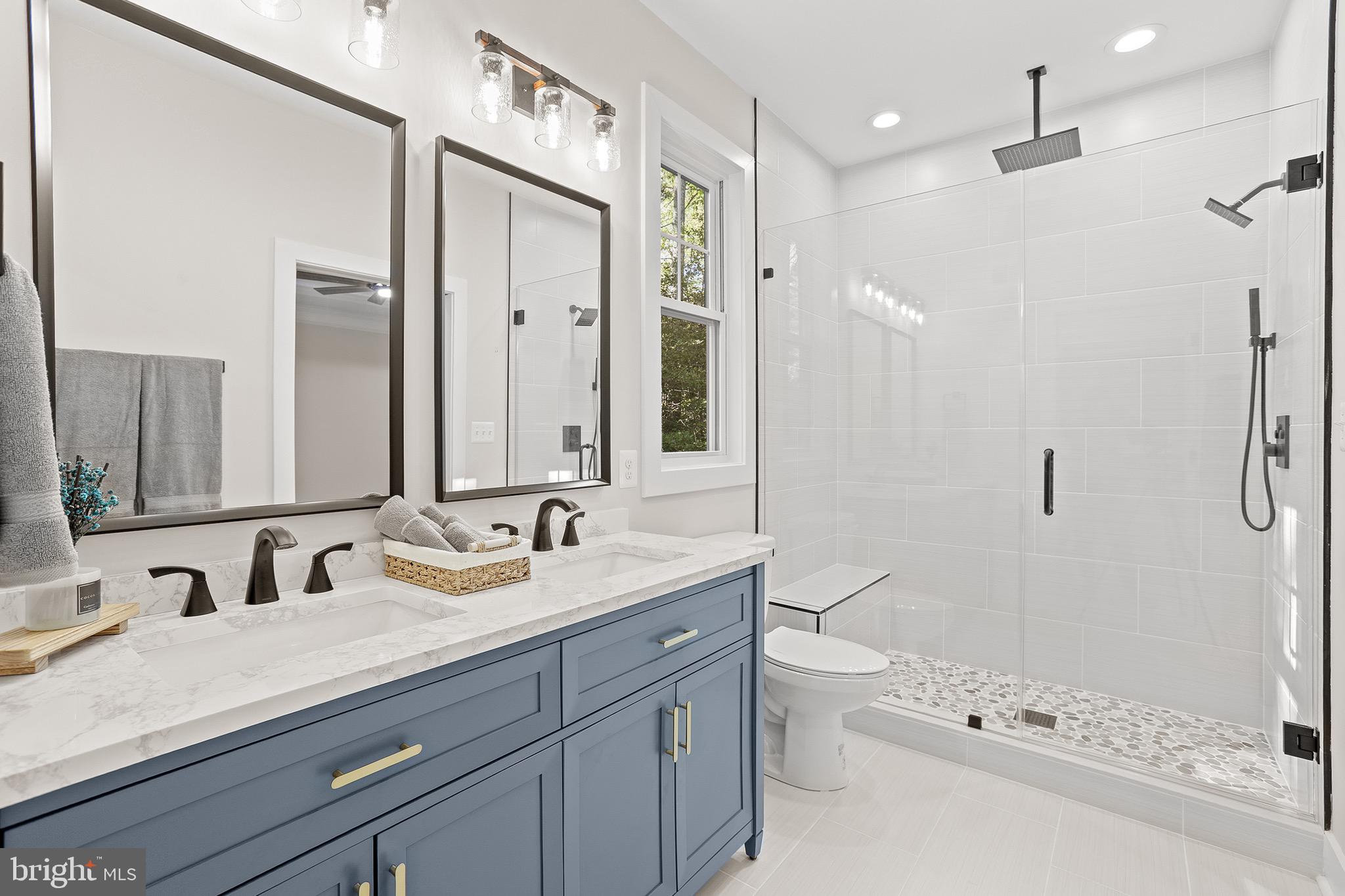 195 North Glebe Road Montross, VA 22520 - Photo 26 of 53 a bathroom with a granite countertop sink a toilet a mirror and shower