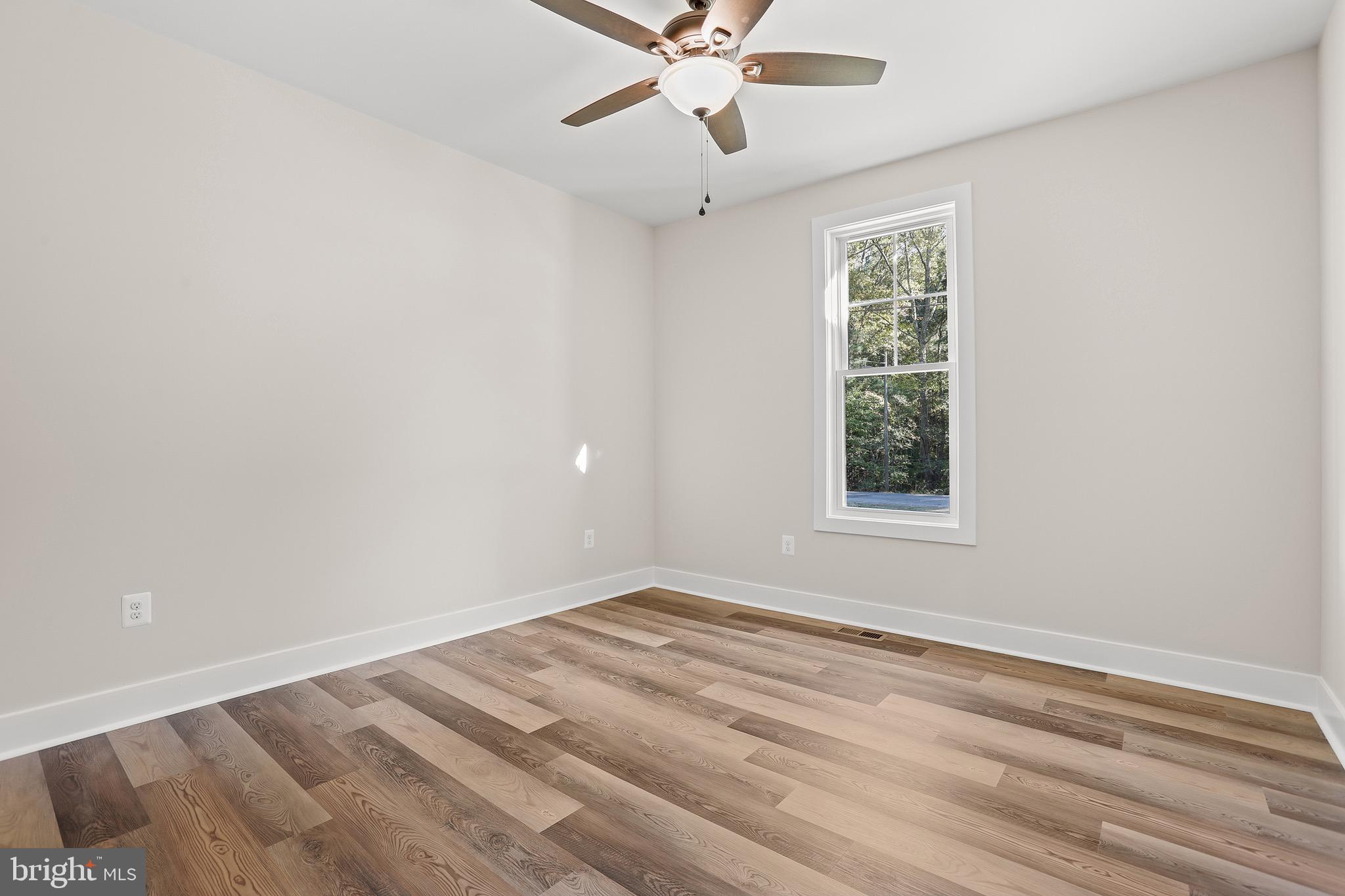 195 North Glebe Road Montross, VA 22520 - Photo 27 of 53 a view of a room with a window and a ceiling fan