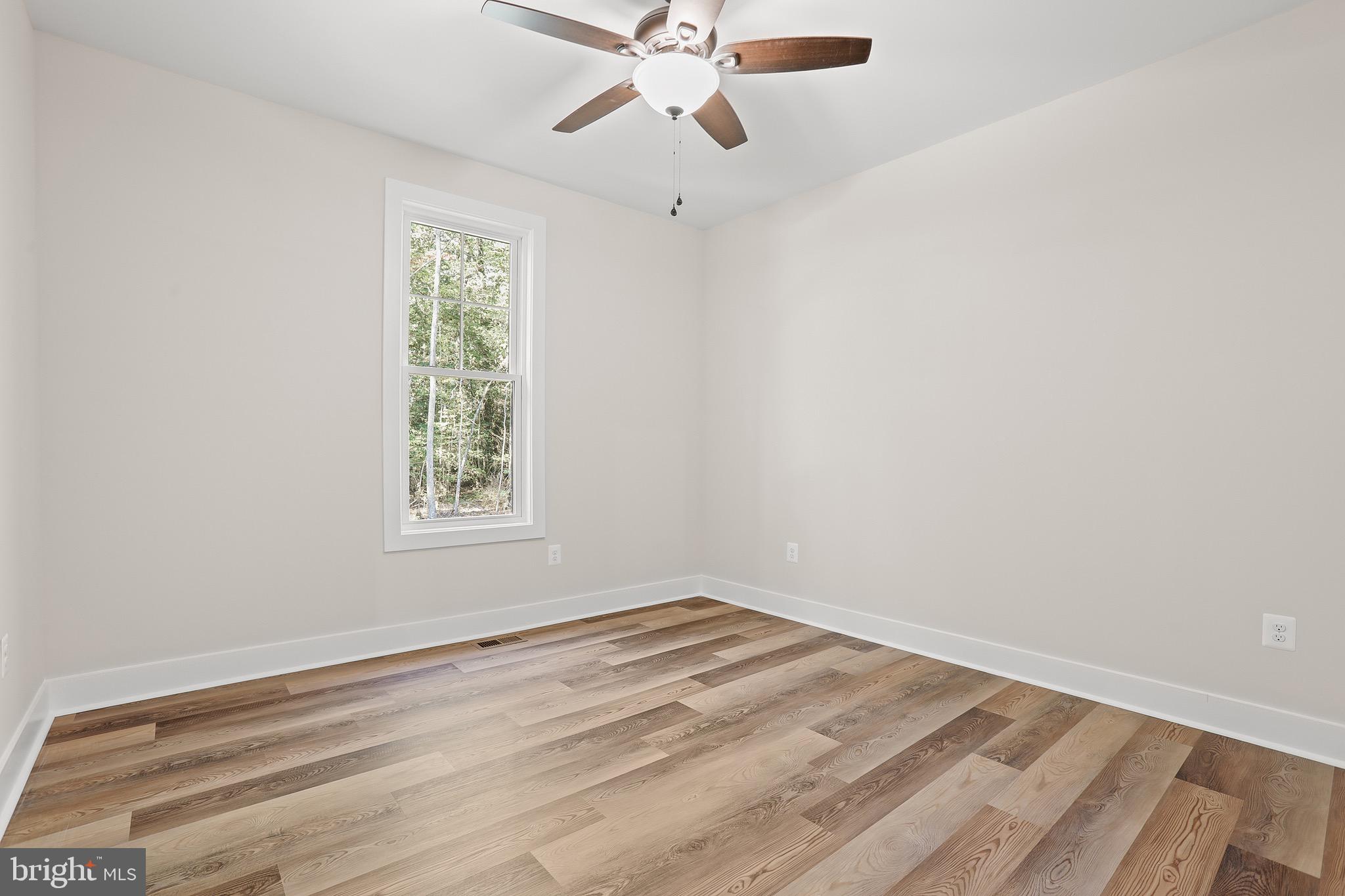 195 North Glebe Road Montross, VA 22520 - Photo 29 of 53 wooden floor in an empty room with a window