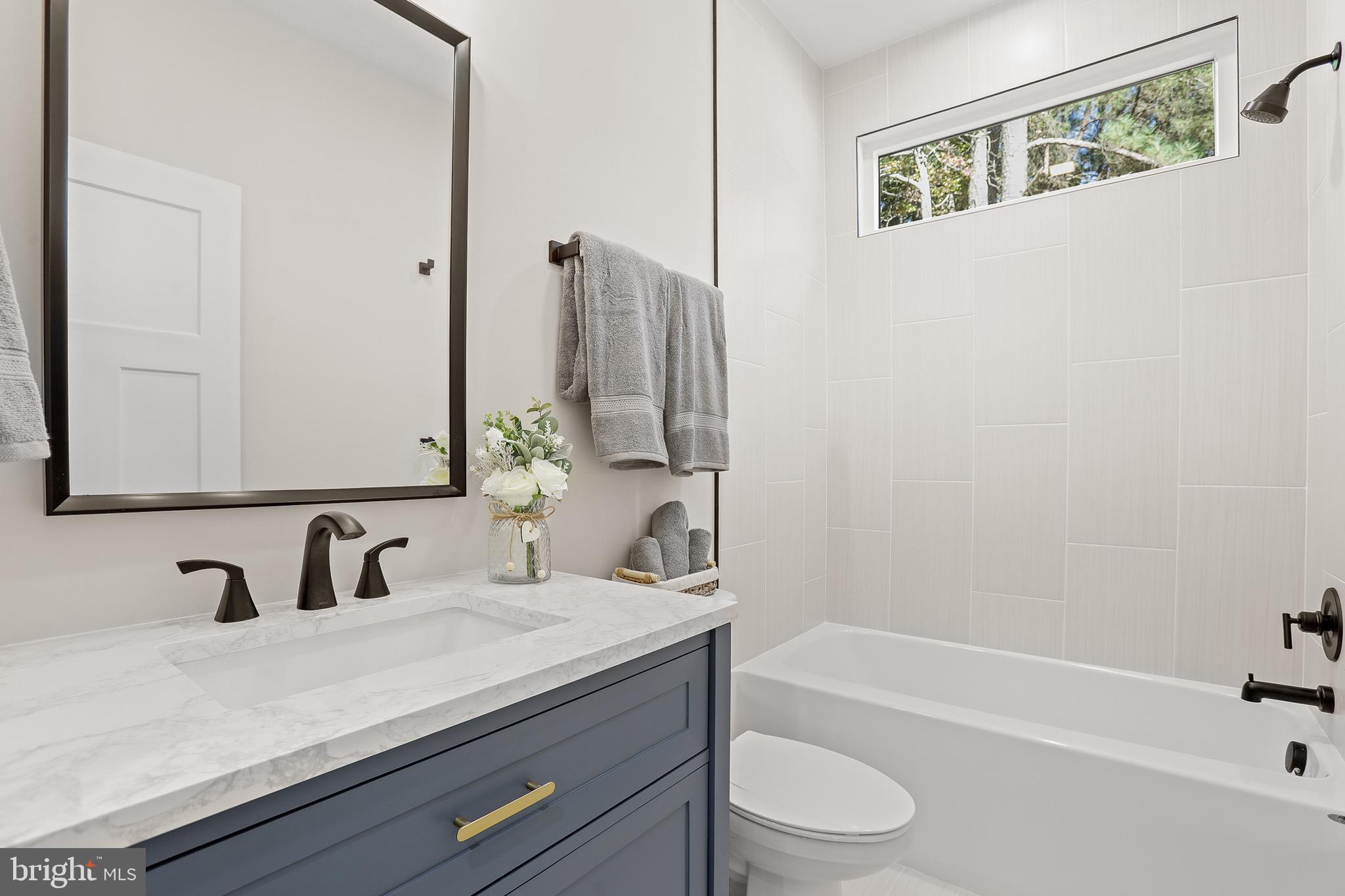 195 North Glebe Road Montross, VA 22520 - Photo 31 of 53 a bathroom with a granite countertop sink toilet and shower