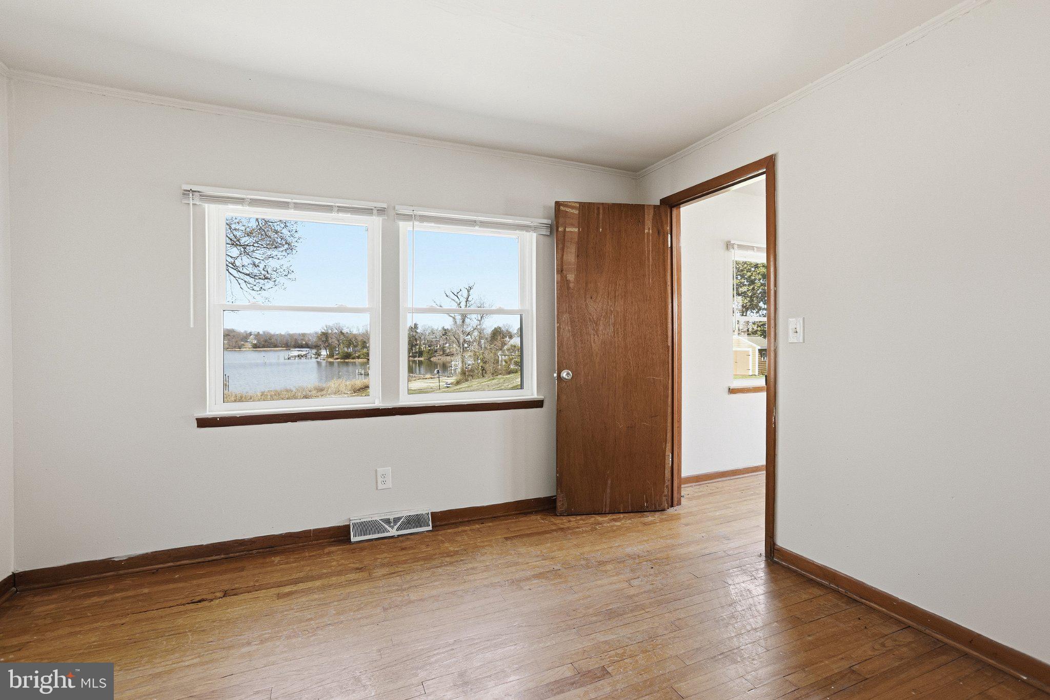 20289 Ridge Road Colonial Beach, VA 22443 - Photo 14 of 28 Serene lakeside view from a cozy room.