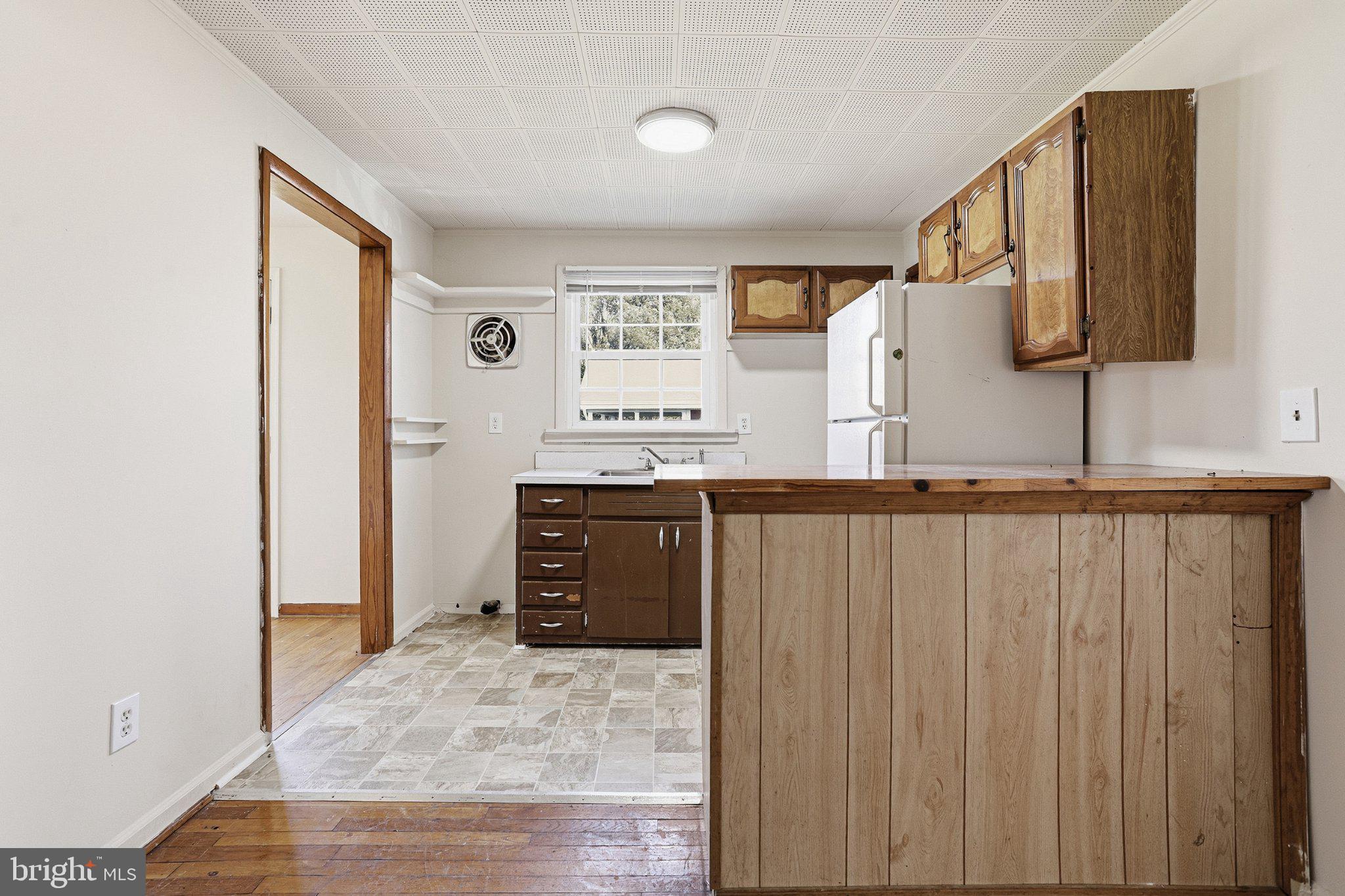 20289 Ridge Road Colonial Beach, VA 22443 - Photo 9 of 28 Cozy kitchen with rustic charm.