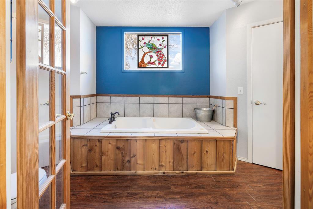 401 Sandy Lane Dublin, TX 76446 - Photo 16 of 39 a bedroom with a bed and a window