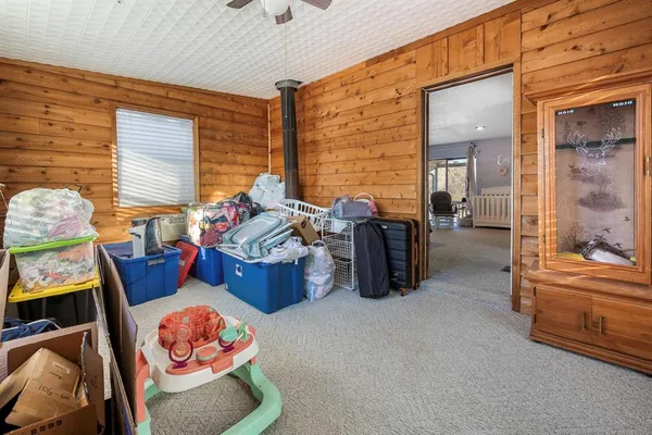 a bedroom with furniture and a window