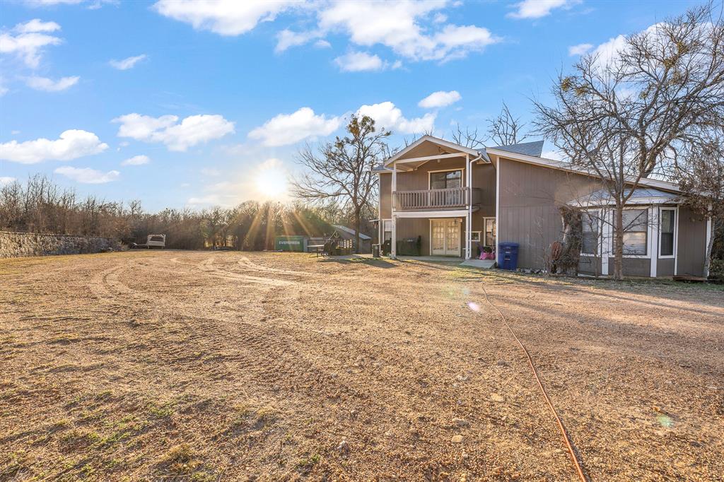 401 Sandy Lane Dublin, TX 76446 - Photo 26 of 39 a front view of a house with a yard