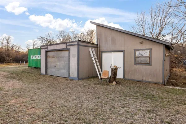 a view of a house with a snow in the yard