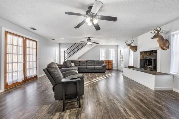 a living room with furniture and a fireplace