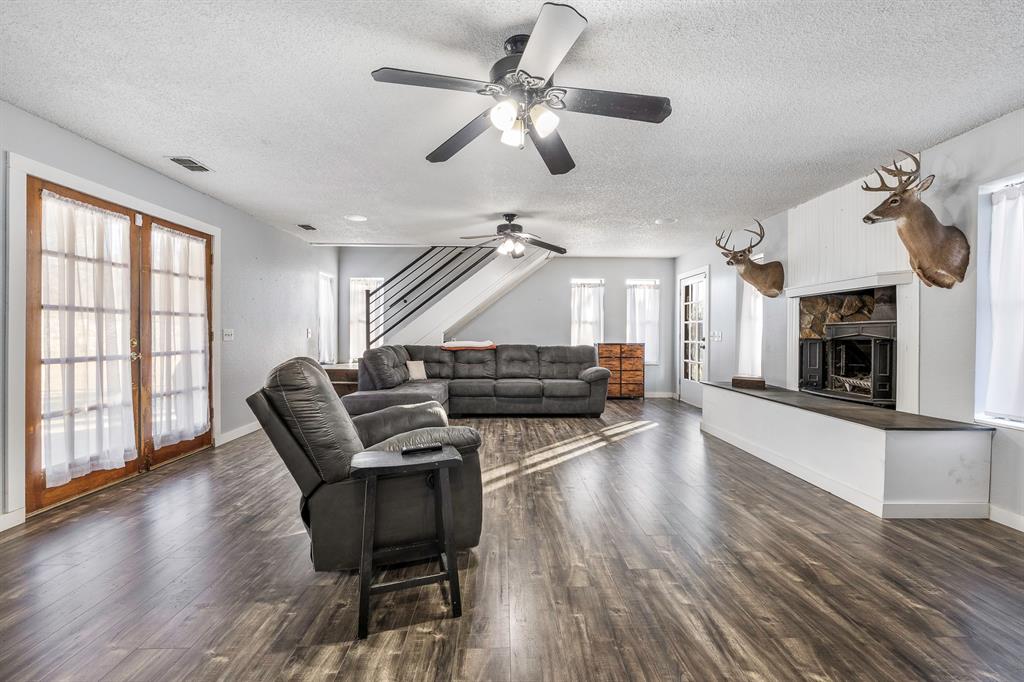 401 Sandy Lane Dublin, TX 76446 - Photo 4 of 39 a living room with furniture and a fireplace