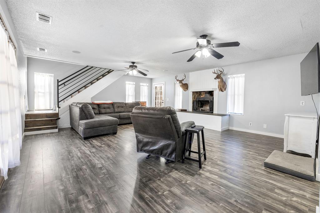 401 Sandy Lane Dublin, TX 76446 - Photo 6 of 39 a living room with furniture and a wooden floor