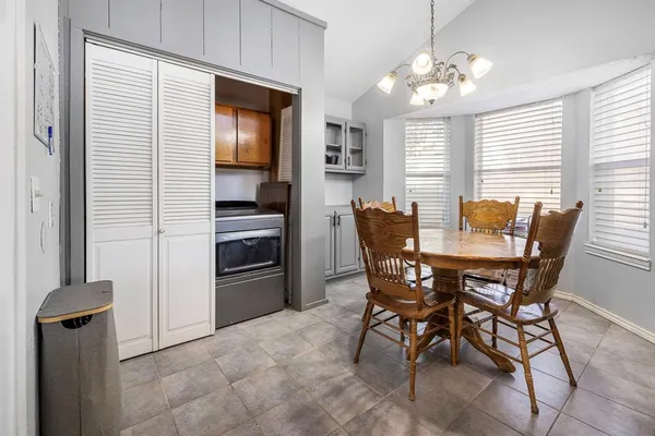 a view of a dining room with furniture and window