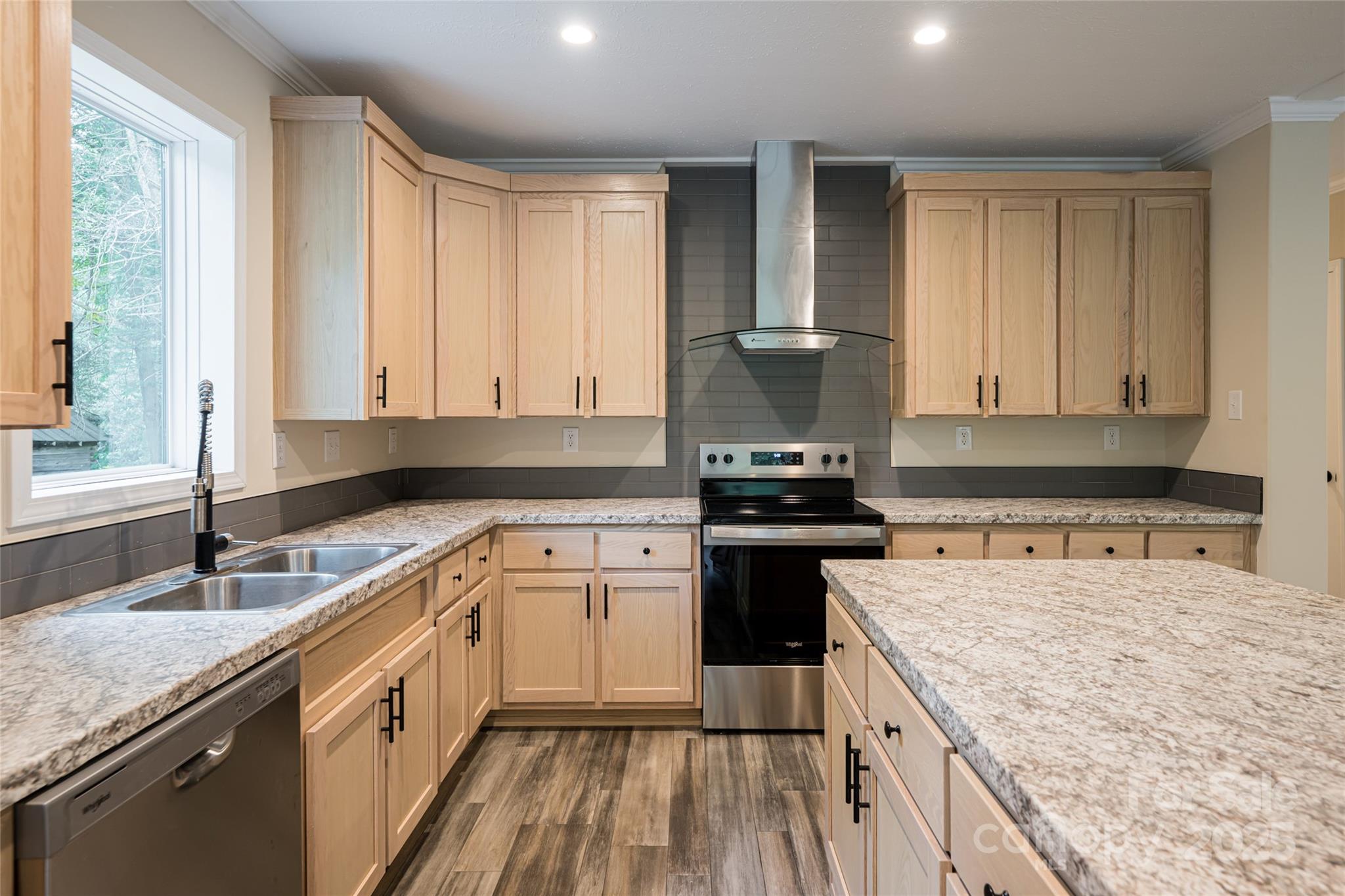 321 Flat Creek Road Black Mountain, NC 28711 - Photo 12 of 44 a kitchen with a sink stove and cabinets