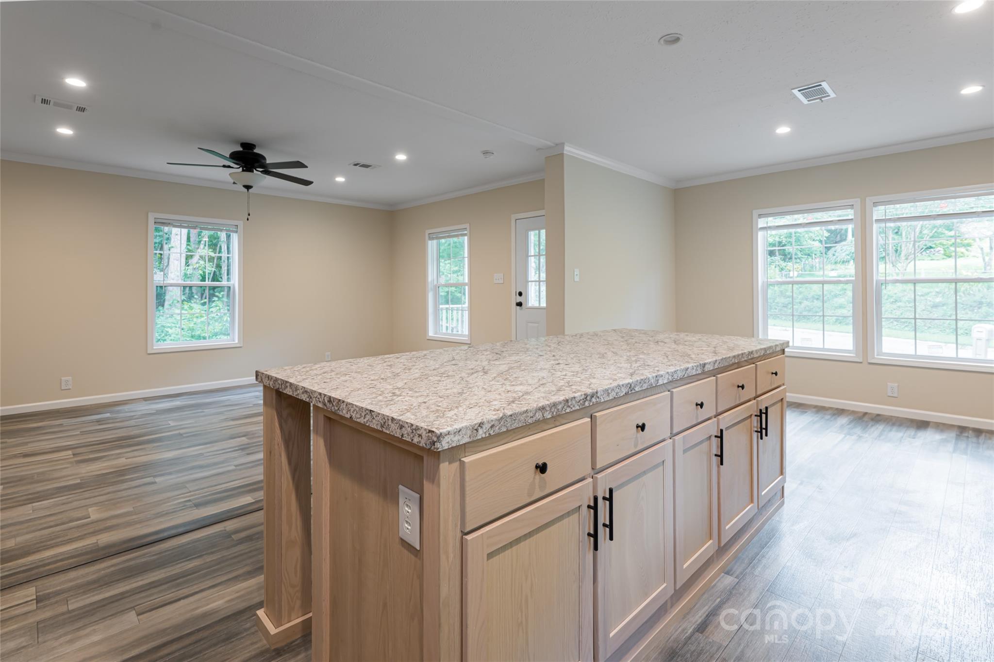 321 Flat Creek Road Black Mountain, NC 28711 - Photo 14 of 44 wooden floor in an empty room with a window