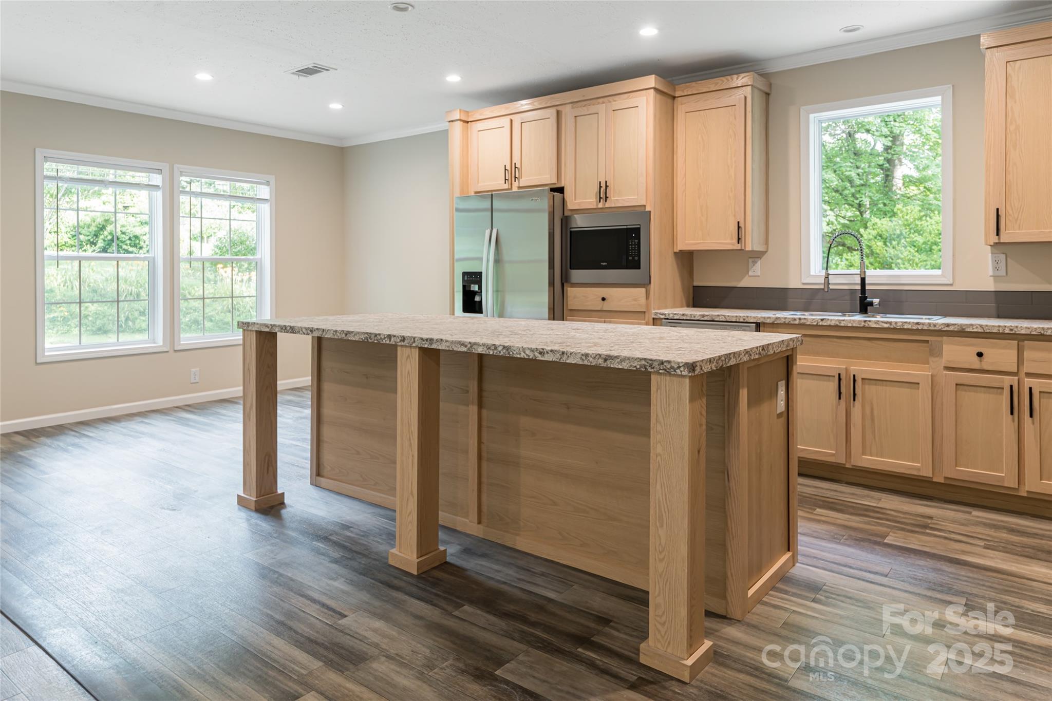 321 Flat Creek Road Black Mountain, NC 28711 - Photo 15 of 44 a kitchen with stainless steel appliances granite countertop a stove a sink and a microwave