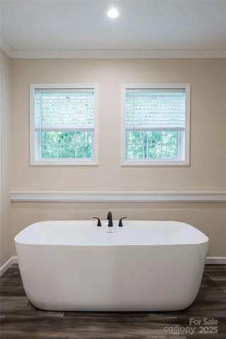 a white bath tub sitting in a bathroom