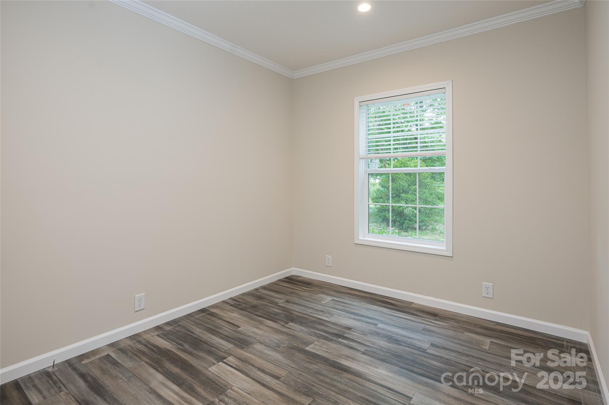 321 Flat Creek Road Black Mountain, NC 28711 - Photo 30 of 44 an empty room with wooden floor and windows