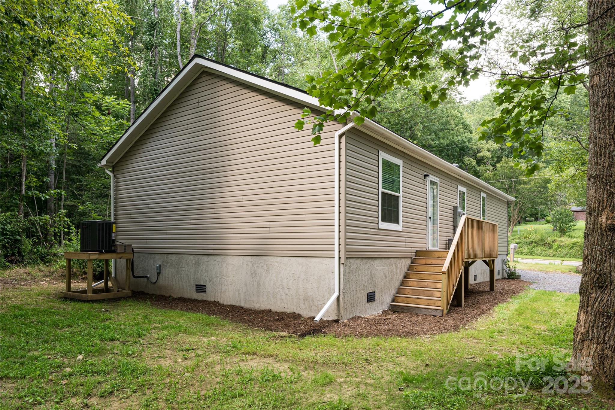 321 Flat Creek Road Black Mountain, NC 28711 - Photo 42 of 44 a view of backyard with wooden fence and a bench