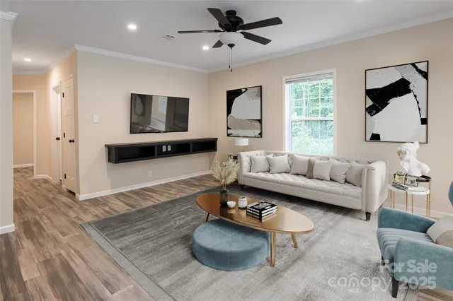 a living room with furniture and a flat screen tv