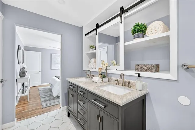 a bathroom with a sink and a mirror
