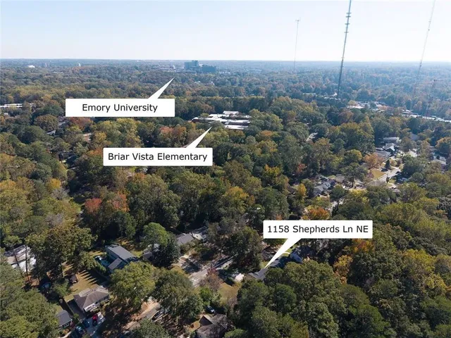 an aerial view of house and yard