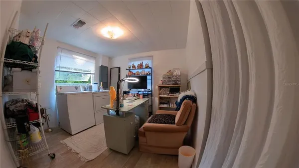 a view of a dining room with furniture window and outside view