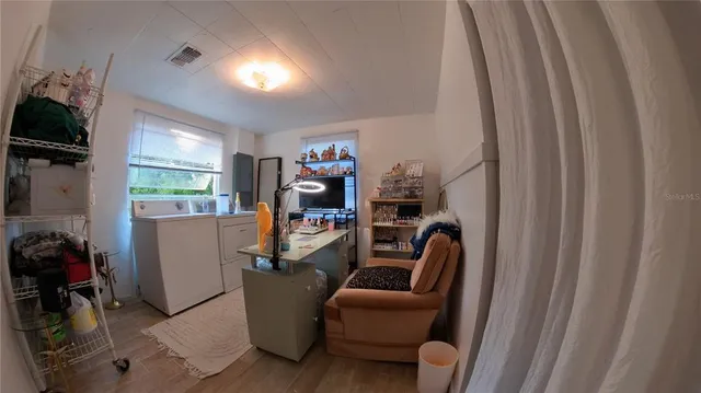a view of a dining room with furniture window and outside view