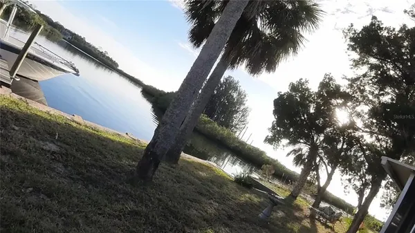 a kitchen with granite countertop a refrigerator stove and sink