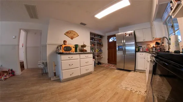 a view of a kitchen and dining room