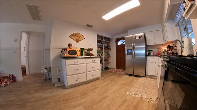 a view of a kitchen and dining room