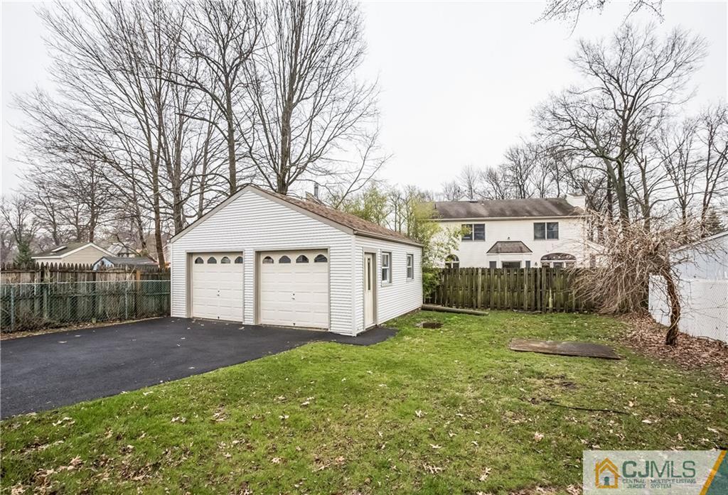 41 West Cliff Road Colonia, NJ 07067 - Photo 23 of 23 a view of a house with a yard and garage
